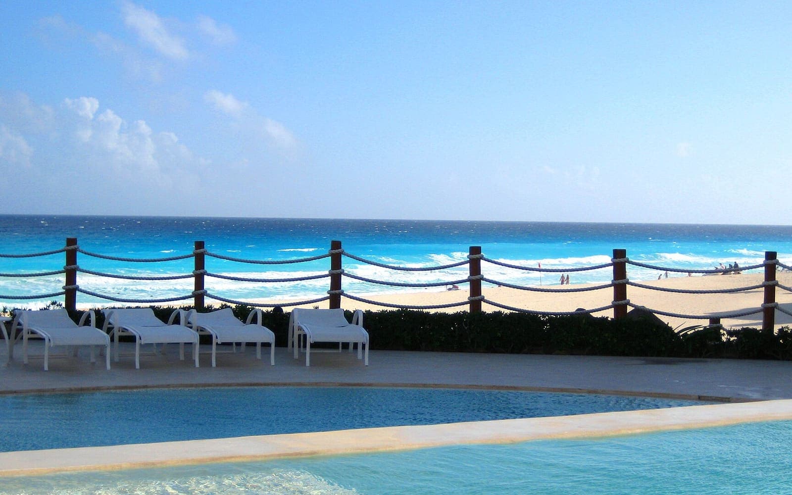 A quieter resort pool — the adults-only side of the comparison