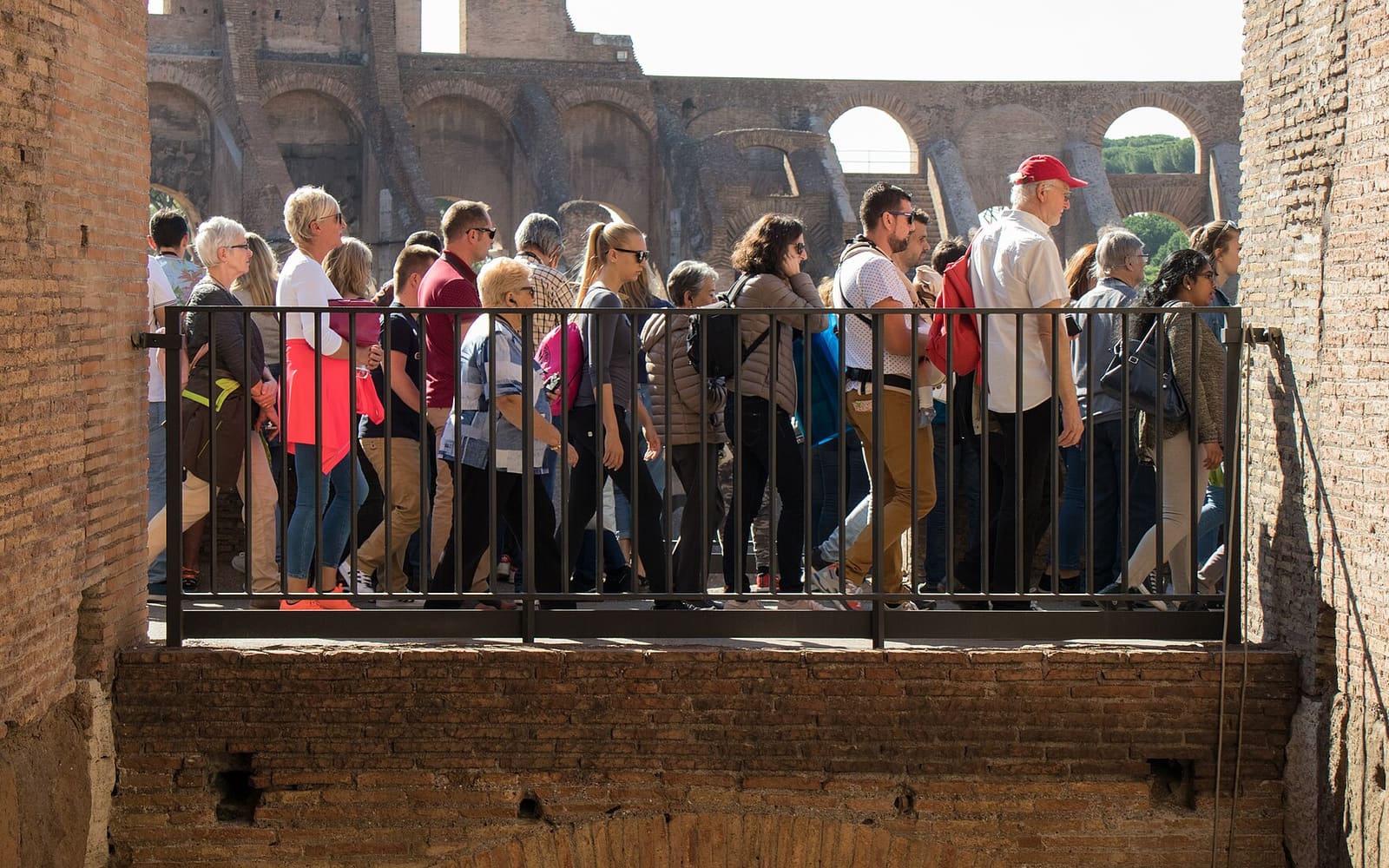 A travel group walking through the Colosseum